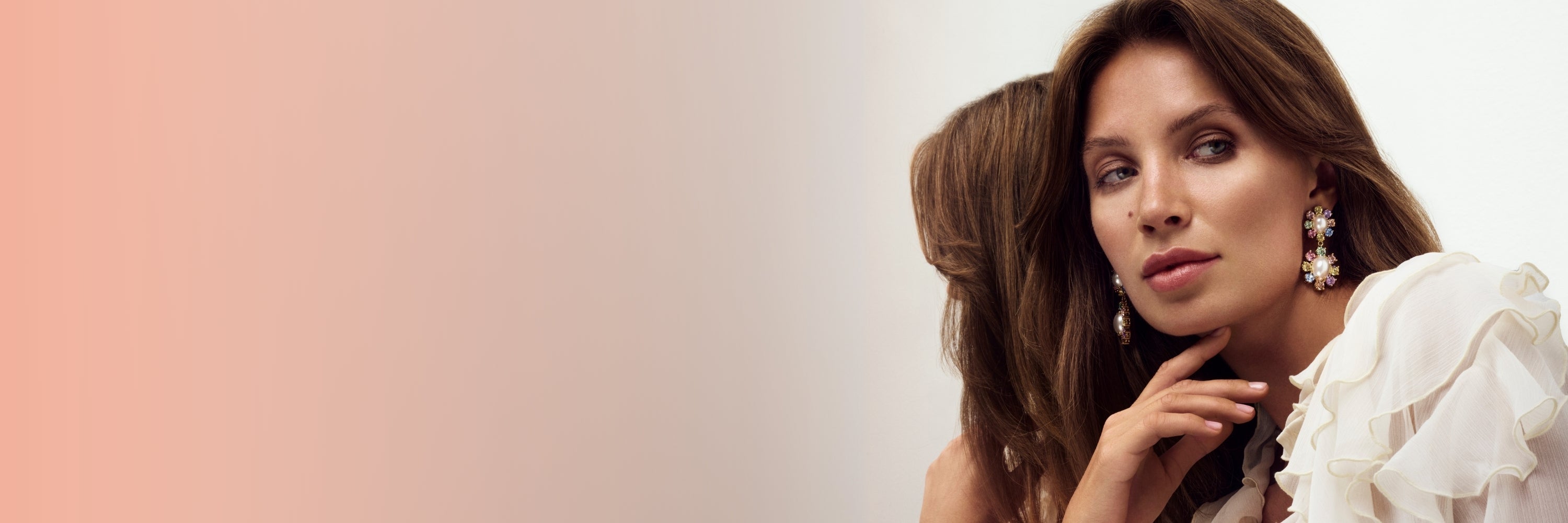 Image of Dyrberg/Kern model showing the new Lina earrings in gold multi pastel tones