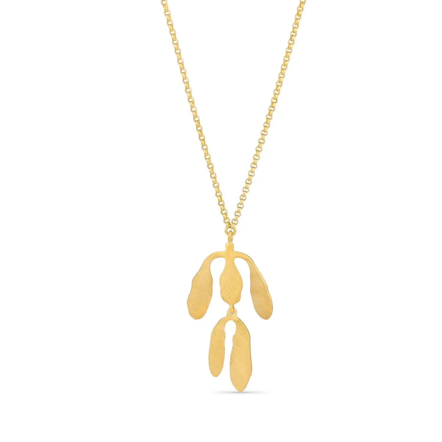 Gold necklace with a leaf-shaped pendant on a white background