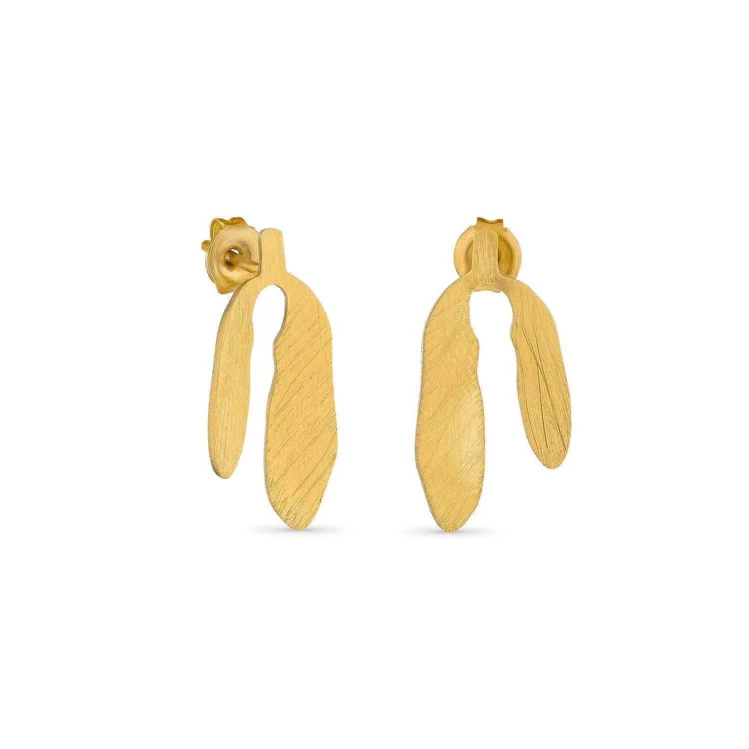 Gold earrings on a white background
